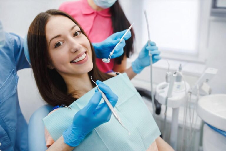 Patient smiling during cosmetic dental treatment as part of dental facial rejuvenation to improve smile appearance and facial harmony.