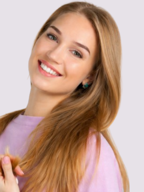 Woman with bright healthy smile showing results of dental facial rejuvenation treatment that improves teeth appearance and facial harmony.